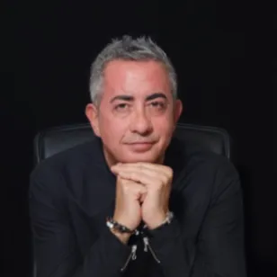 Portrait for Festival dei Due Mondi, man in black shirt resting chin on hands