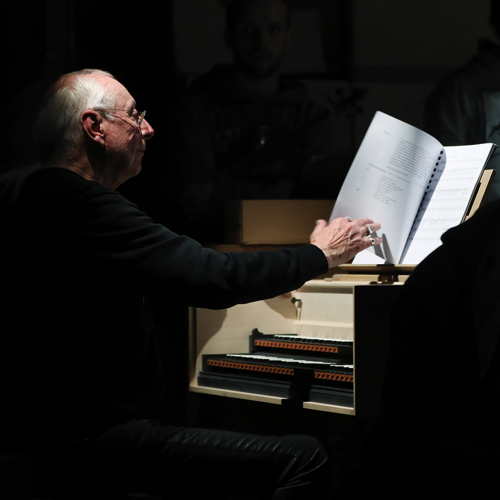 Portrait for Festival dei Due Mondi: Elderly musician playing harpsichord intently