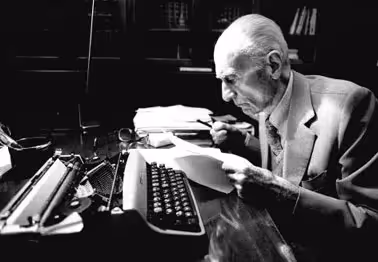 Elderly writer at typewriter during Festival di Spoleto cultural event