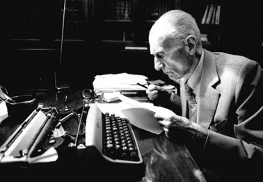 Elderly writer at typewriter during Festival di Spoleto cultural event