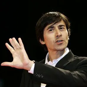 Performer gesturing on stage at Festival di Spoleto cultural event