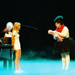 Performers on stage at Festival di Spoleto, theatrical scene with dramatic lighting