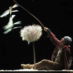 Performer at Festival di Spoleto creates dreamlike scene with oversized dandelion prop