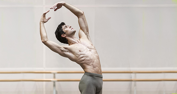 Dancer performing graceful pose at Festival di Spoleto, artistic ballet movement