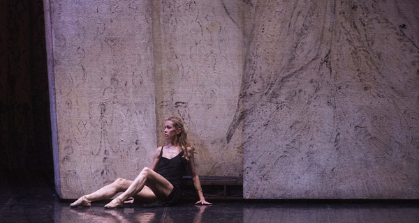 Dancer performing at Festival di Spoleto, sitting contemplatively on stage