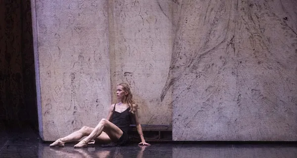 Dancer performing at Festival di Spoleto, sitting contemplatively on stage