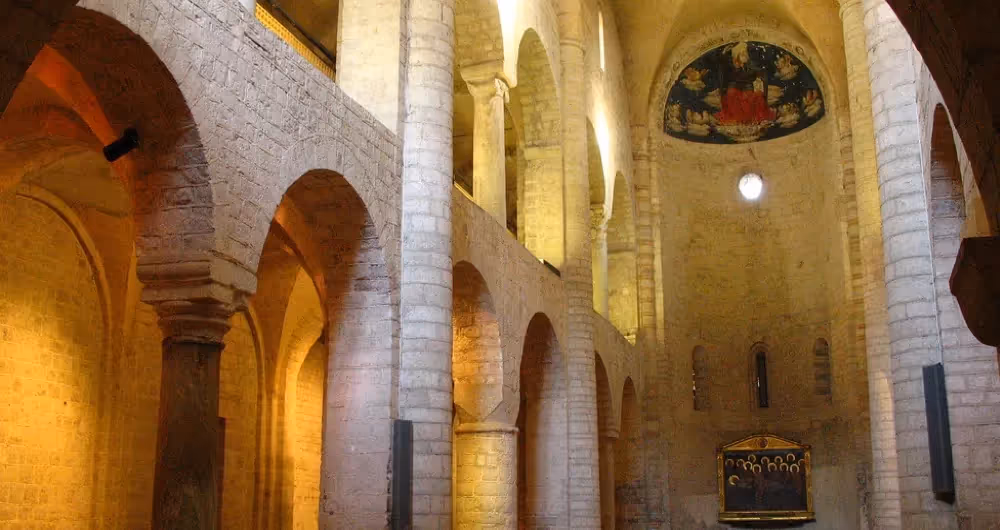 Festival di Spoleto architectural interior with stone arches and golden light