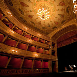 Ornate interior of Teatro Nuovo at Festival di Spoleto with golden chandelier