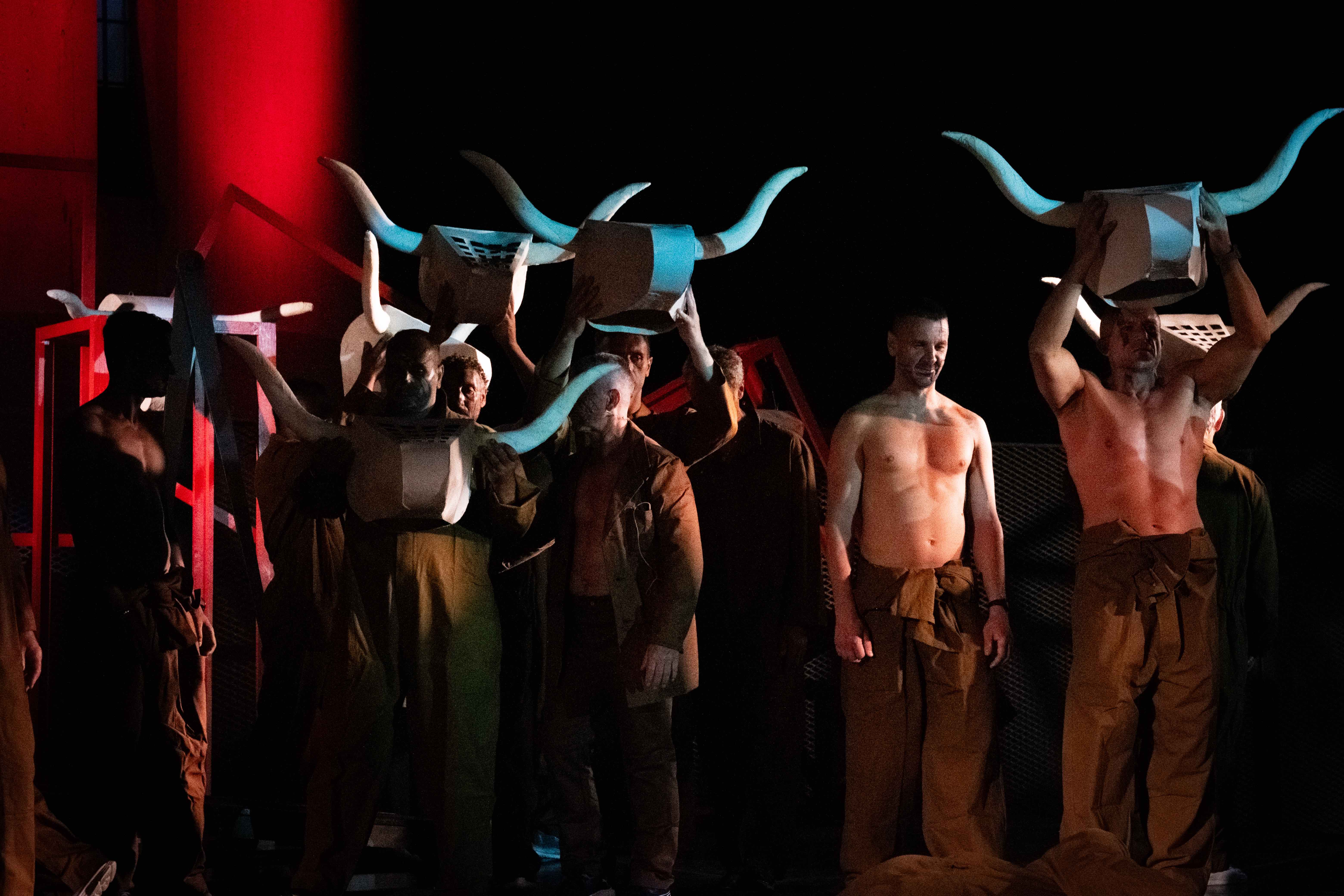 Festival di Spoleto performance with actors wearing horned masks and minimal clothing