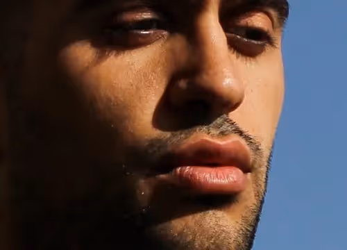 Close-up of person against blue sky at Festival di Spoleto cultural event