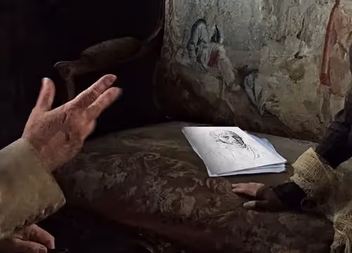 Sketch of face on paper at Festival di Spoleto, artistic hands nearby