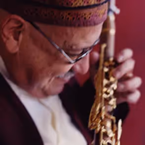 Musician playing saxophone at Festival di Spoleto with passionate expression