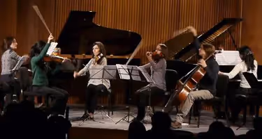 Festival di Spoleto musicians performing classical music on stage with grand pianos