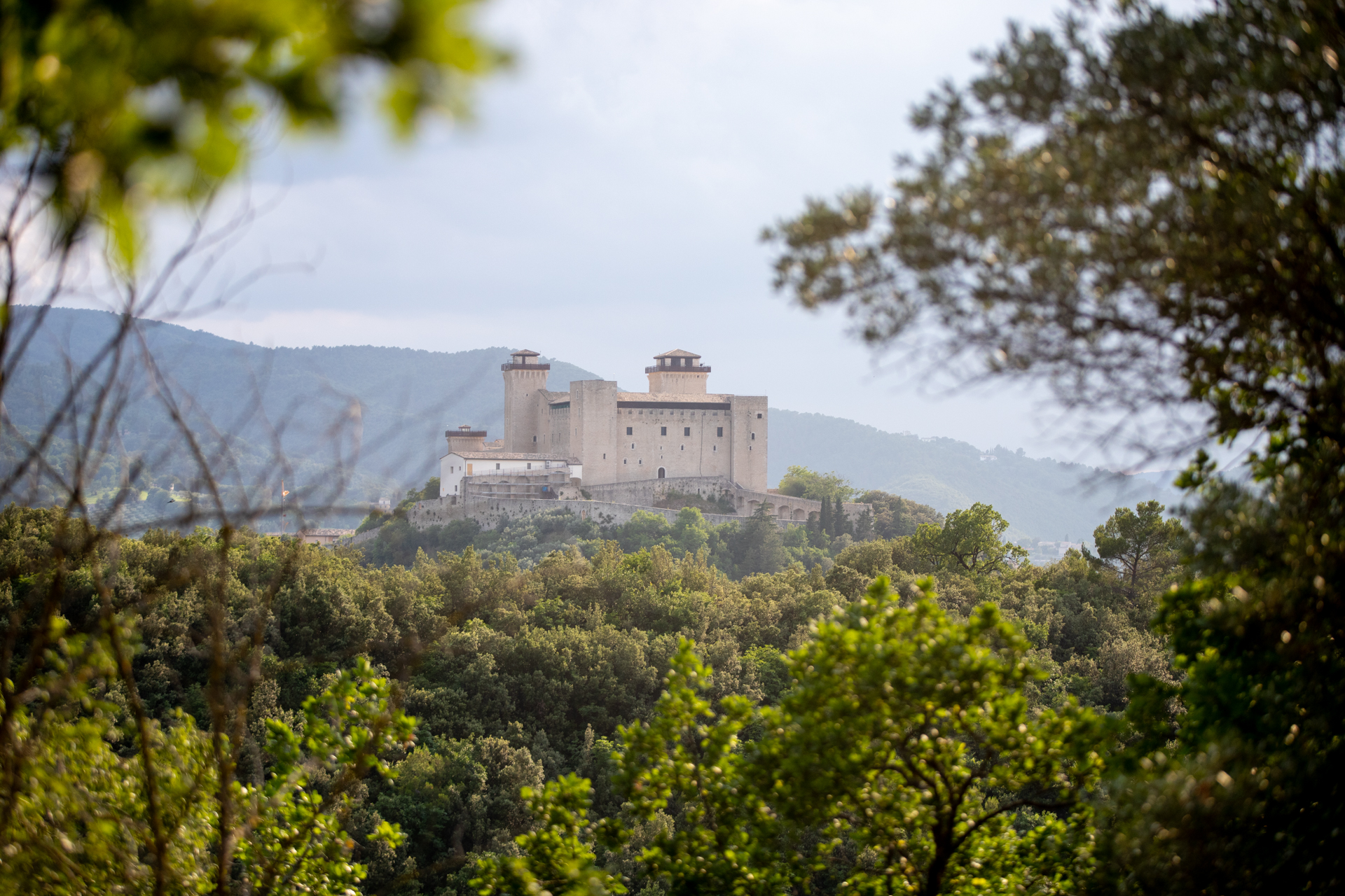 Medieval castle overlooking forest during Festival di Spoleto in Italy