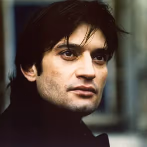 Portrait of a performer at Festival di Spoleto, intense gaze and dark attire