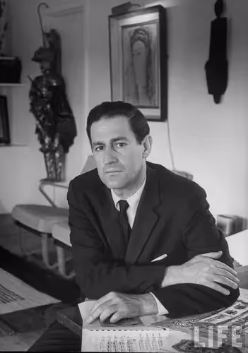 Artistic figure at Festival di Spoleto, seated in black and white portrait