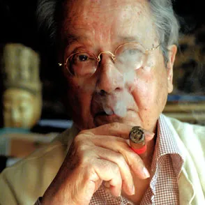 Elderly man smoking cigar at Festival di Spoleto cultural event
