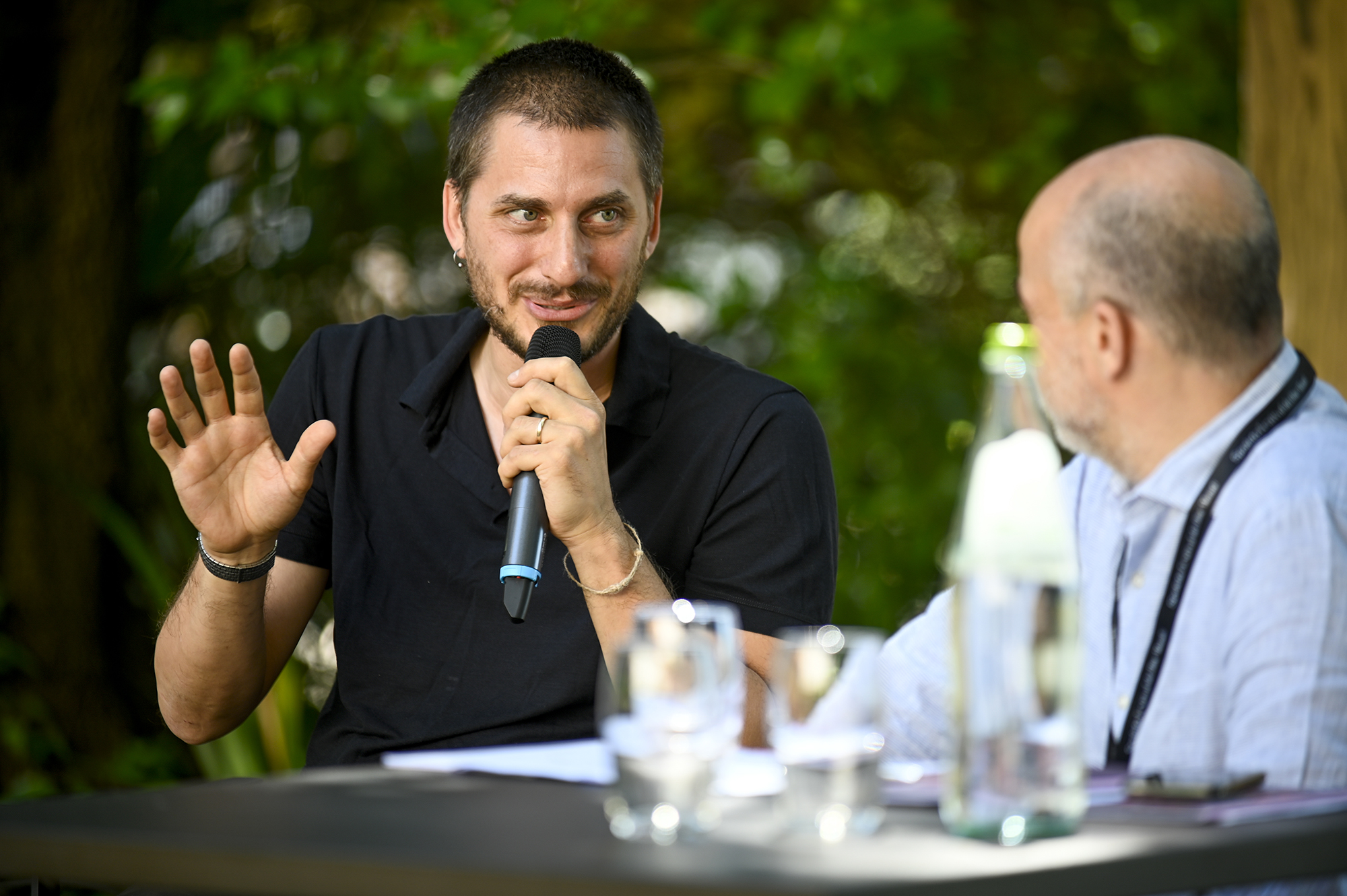 Festival di Spoleto speaker passionately discussing during outdoor panel