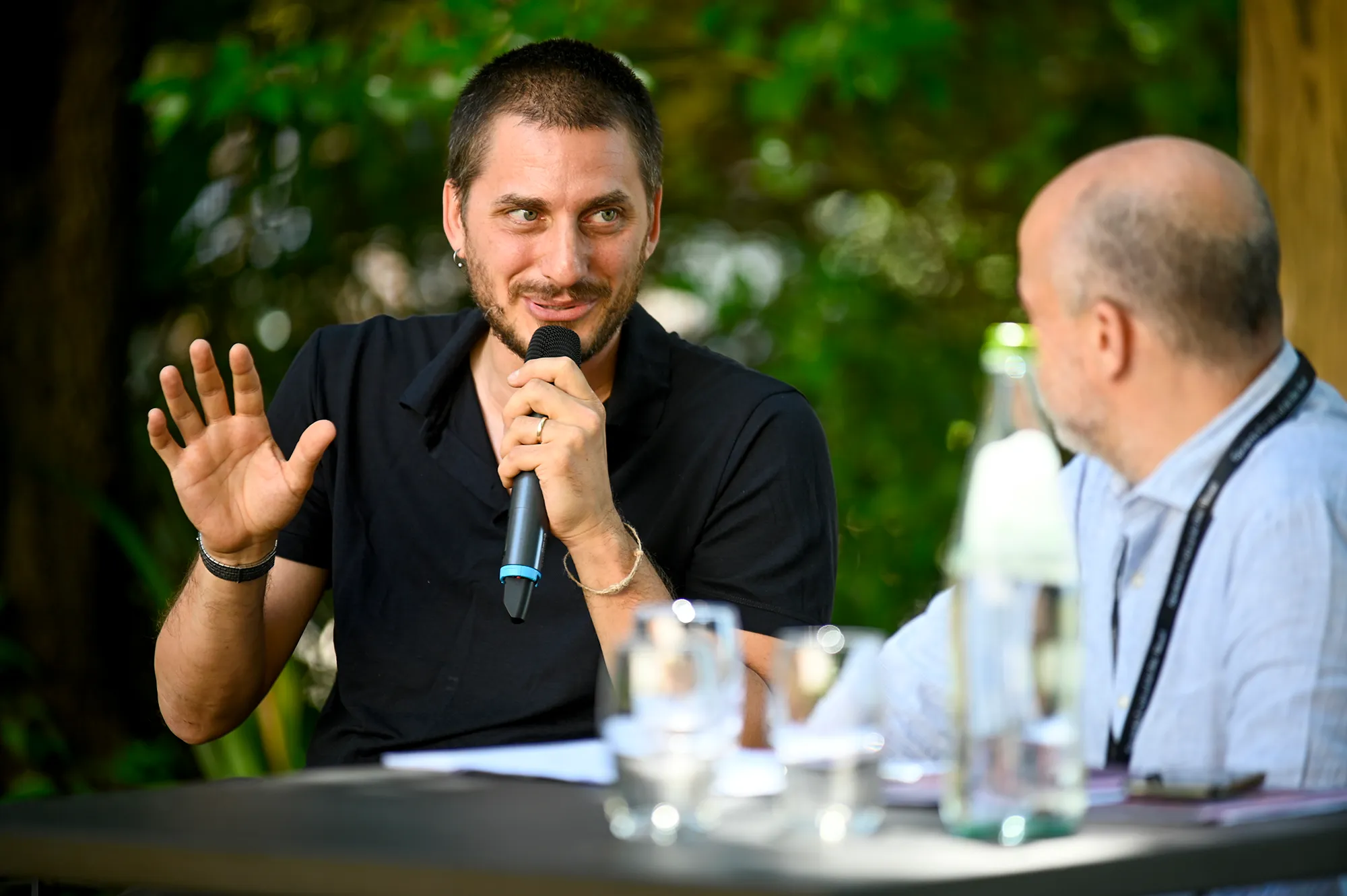 Festival di Spoleto panel discussion with speaker gesturing with microphone