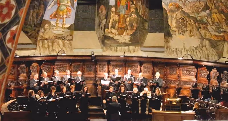 Festival di Spoleto choral performance in ornate historic interior with frescoed walls
