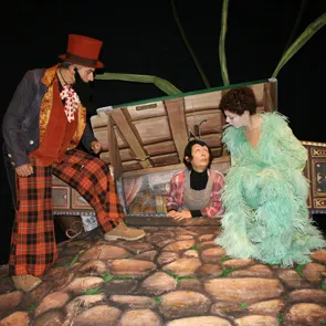 Colorful theatrical scene at Festival di Spoleto with performers on stone stage