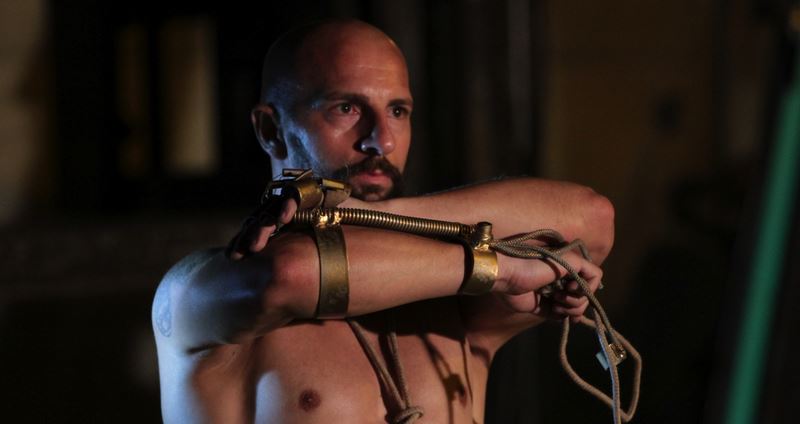 Performance artist at Festival di Spoleto wearing intricate mechanical arm contraption