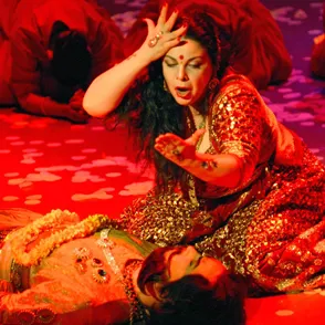 Passionate performance at Festival di Spoleto with vibrant red and golden dancer