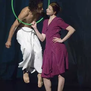 Festival di Spoleto performers in dramatic dance pose with green hoop