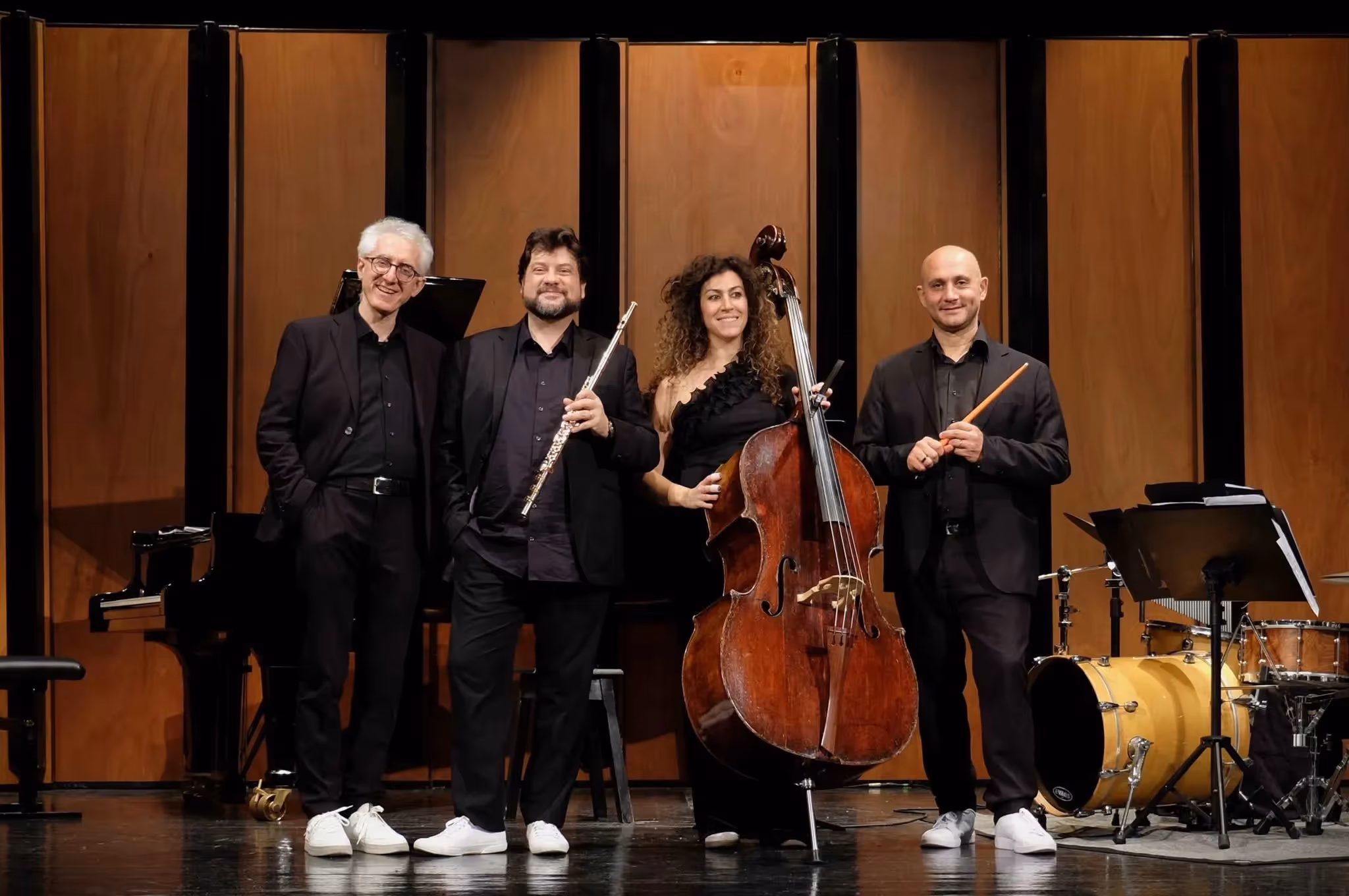 Musical ensemble posing at Festival di Spoleto with classical instruments