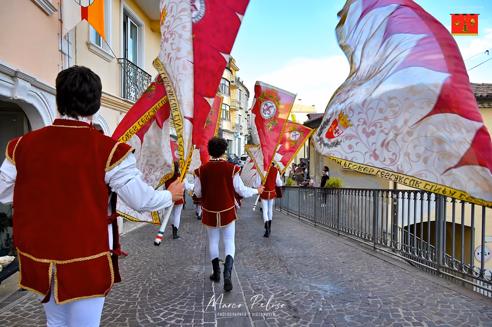 Colorful flag bearers parade through streets during Festival di Spoleto
