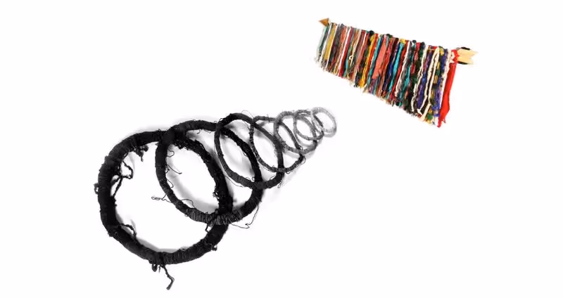 Festival di Spoleto artwork: black spiraling rings meet colorful textured flag