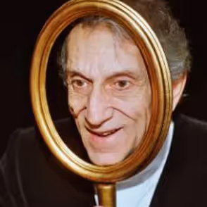 Gian Carlo Menotti, founder of Festival di Spoleto, reflected in golden mirror