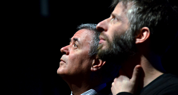 Two men profile view at Festival di Spoleto, contemplative and dramatic lighting