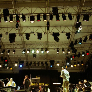Festival di Spoleto stage with colorful lights and musicians performing