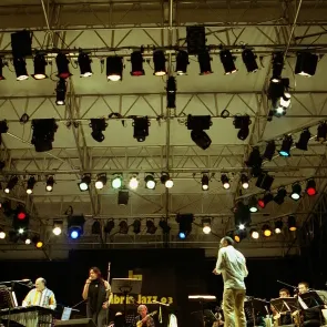 Festival di Spoleto stage with colorful lights and musicians performing