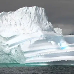 Massive white iceberg floating in gray sea during Festival di Spoleto
