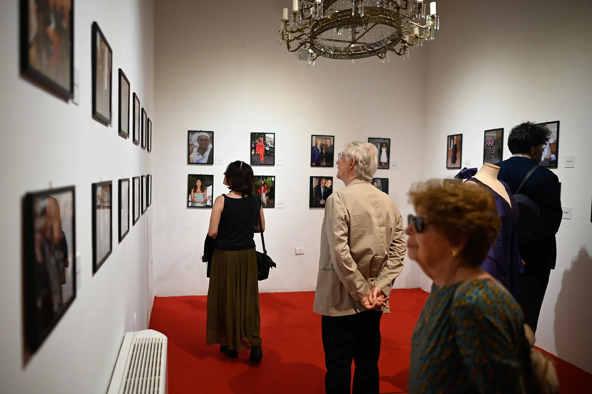 Festival di Spoleto photography exhibition with visitors viewing portraits