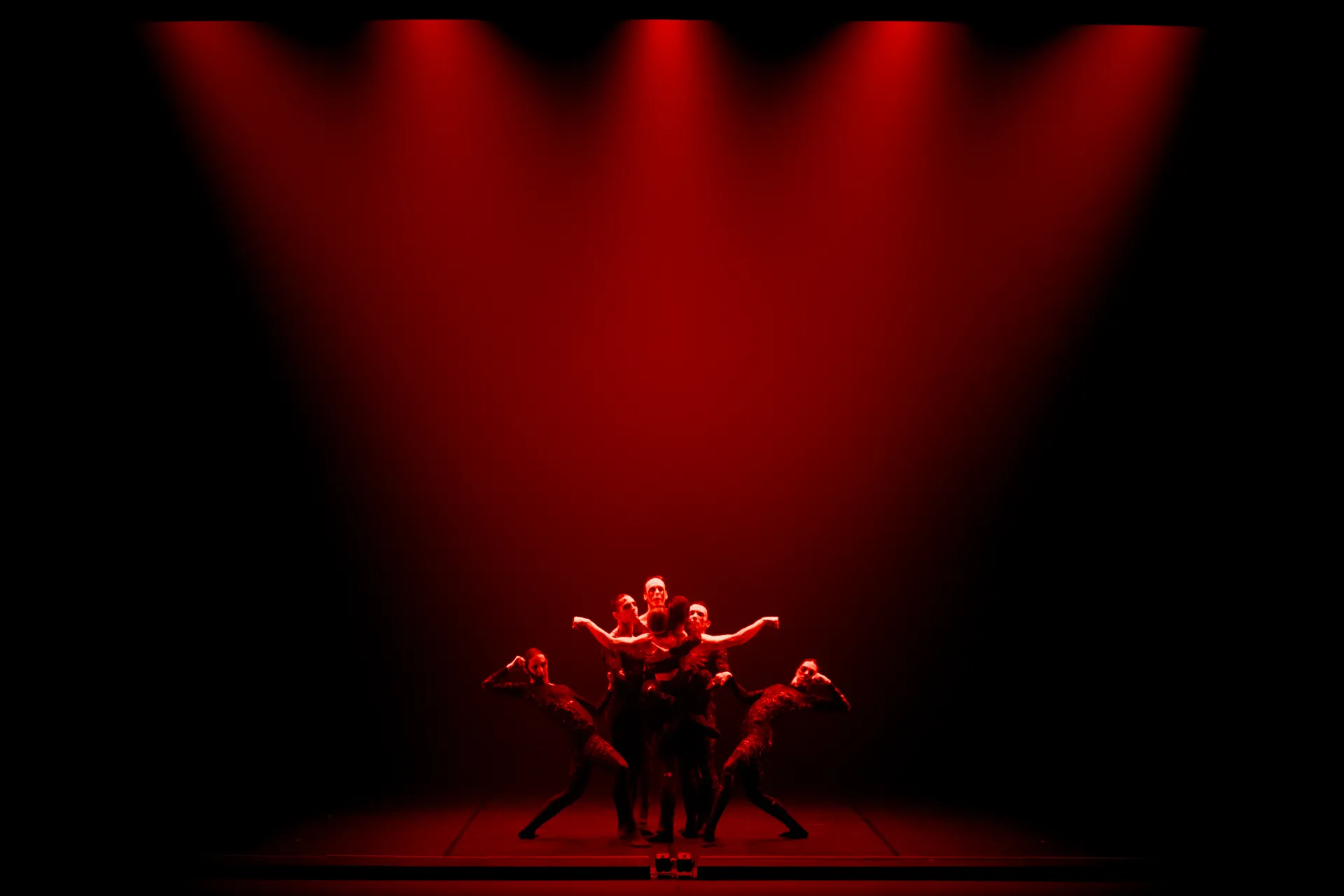 Festival di Spoleto dancers performing dramatic red-lit contemporary dance