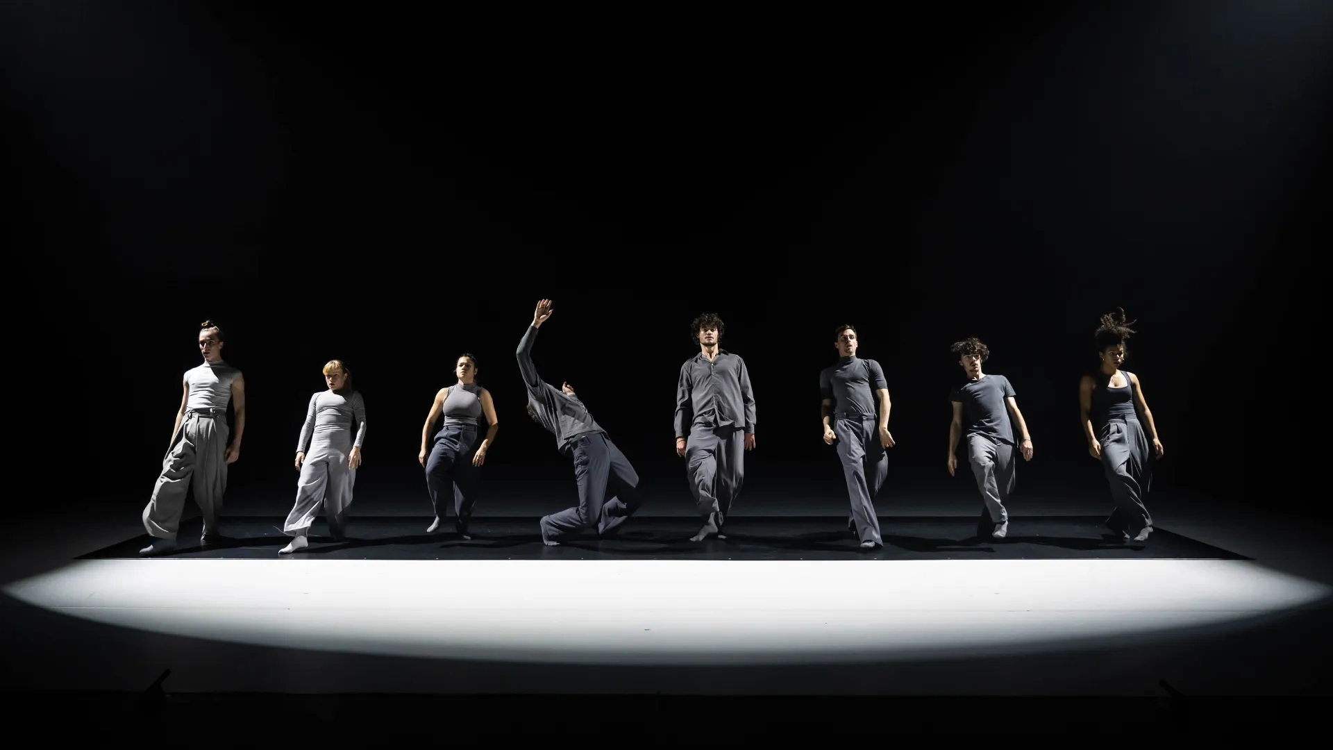 Video performance at Festival di Spoleto featuring dancers in gray costumes