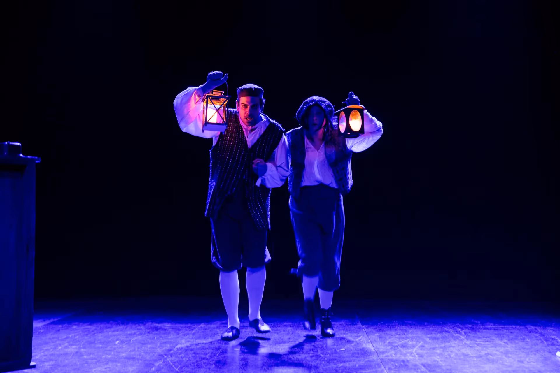 Festival di Spoleto performers in period costumes with glowing lanterns