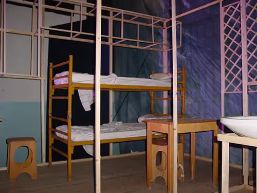 Bunk beds and wooden furniture at Festival di Spoleto exhibition space