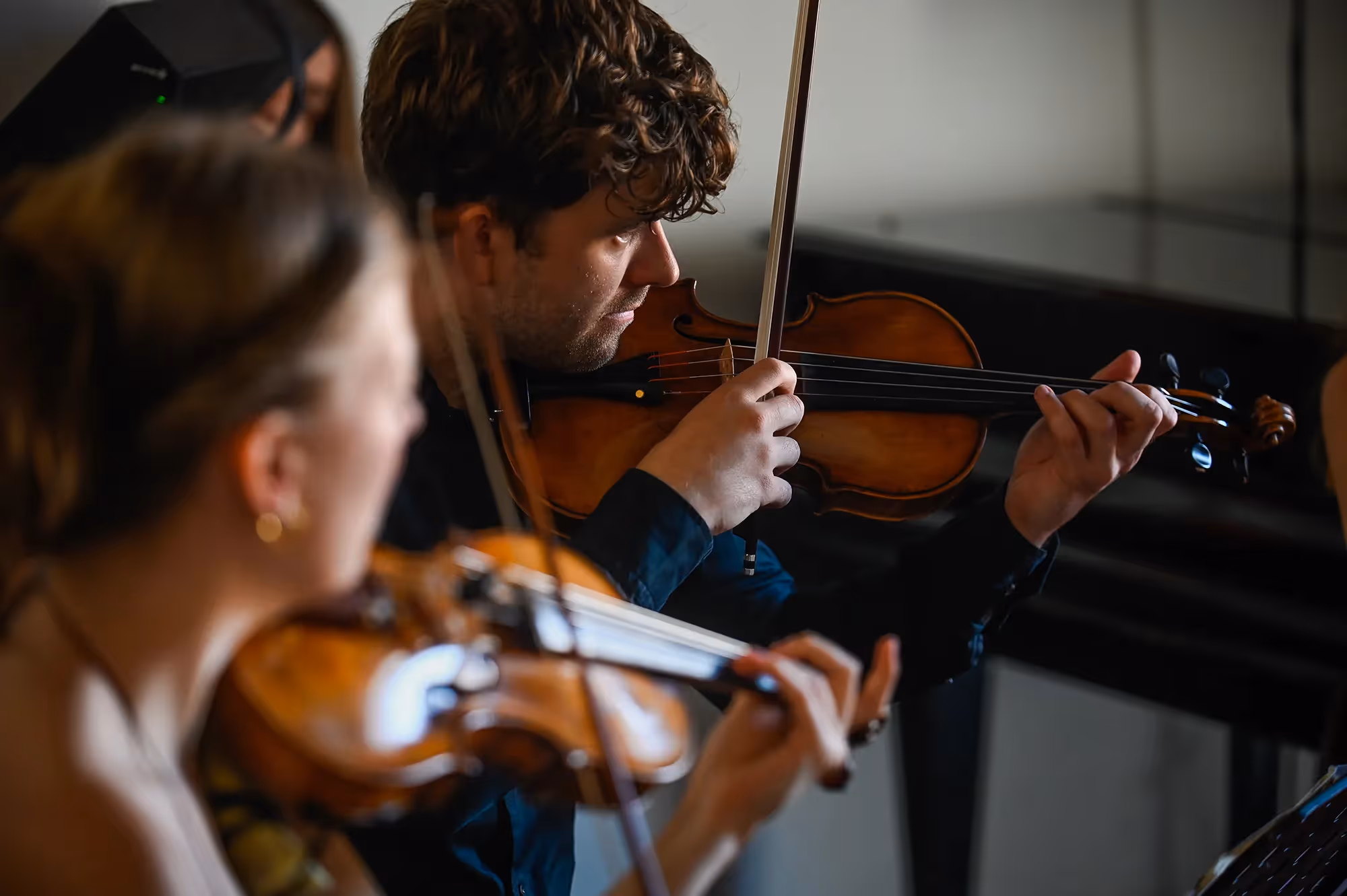 Violinists performing at the Festival di Spoleto, focused and passionate