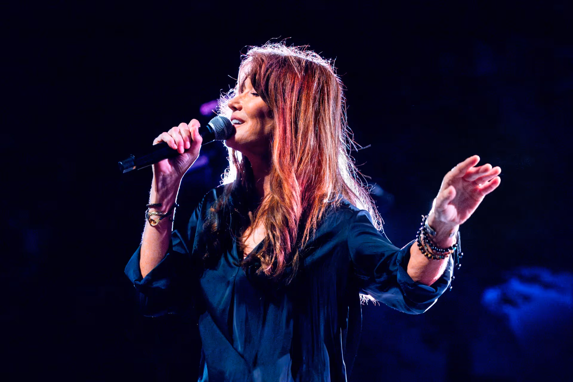 Passionate performance at Festival di Spoleto, singer with microphone on stage