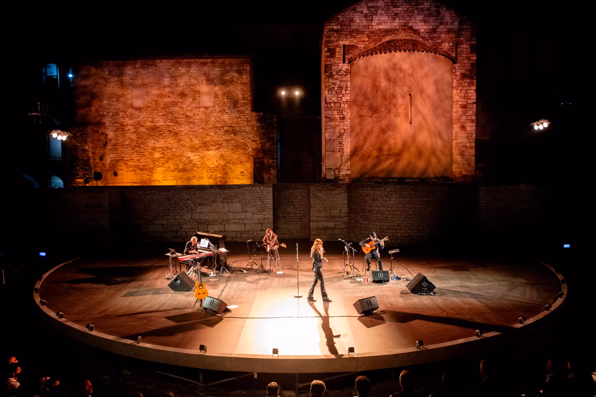 Festival di Spoleto musical performance on historic stone stage with dramatic lighting