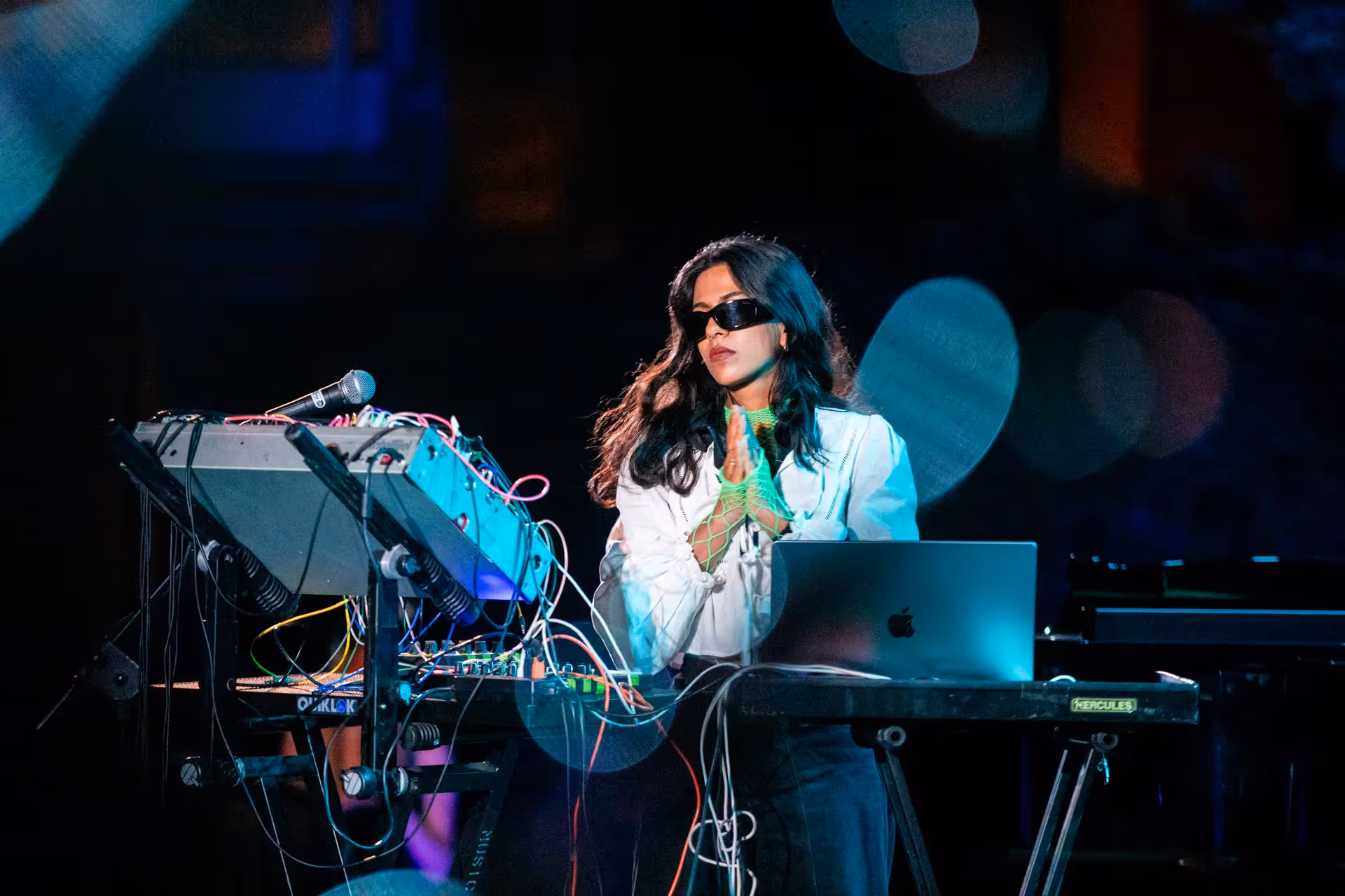 Electronic musician performing at Festival di Spoleto with complex audio equipment