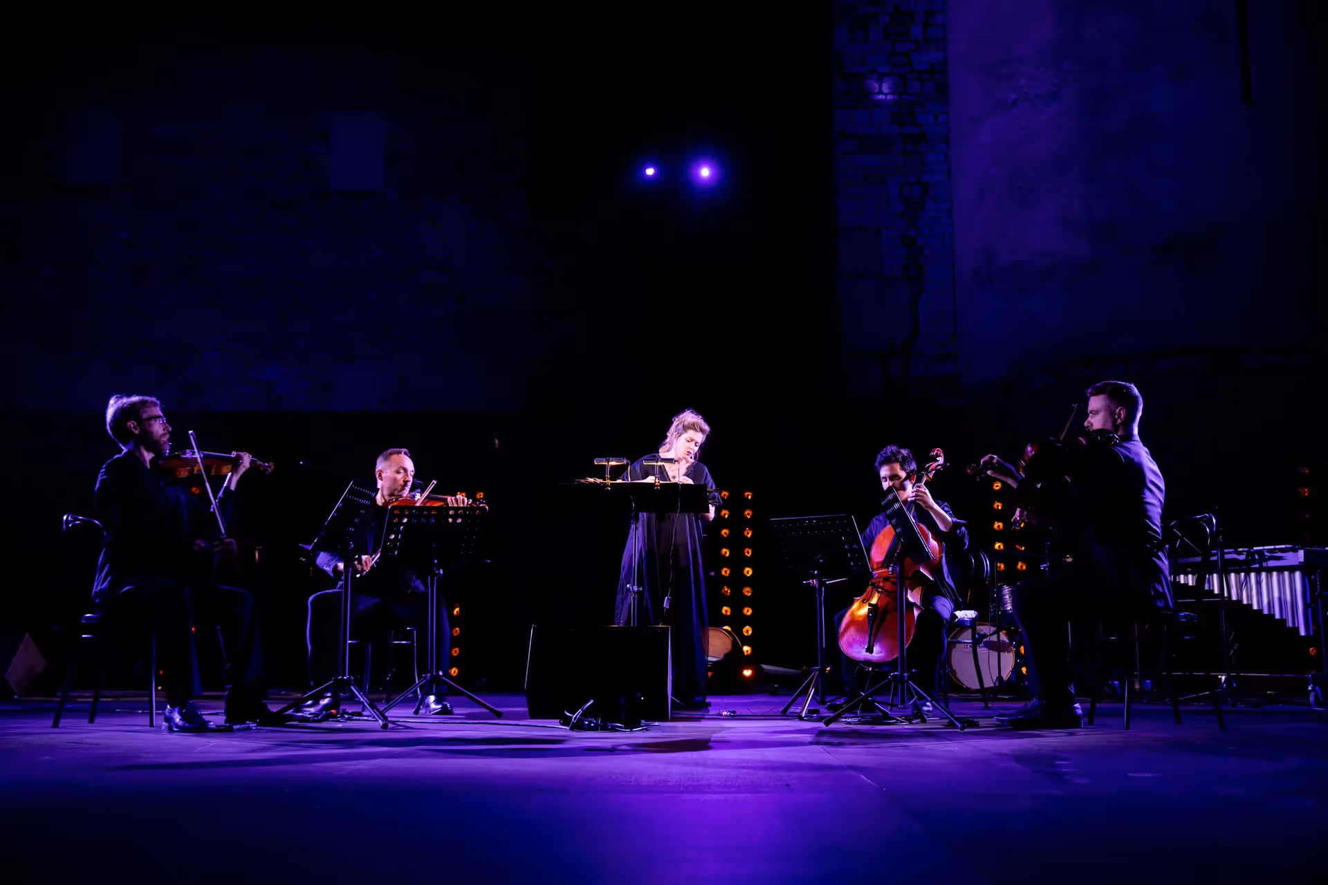 Festival di Spoleto musicians perform dramatic concert under purple stage lights