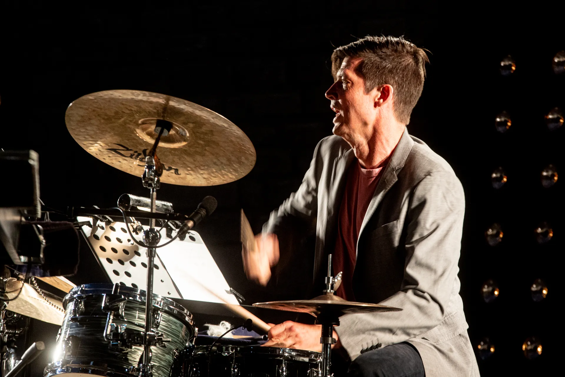 Drummer performing passionately at Festival di Spoleto music event