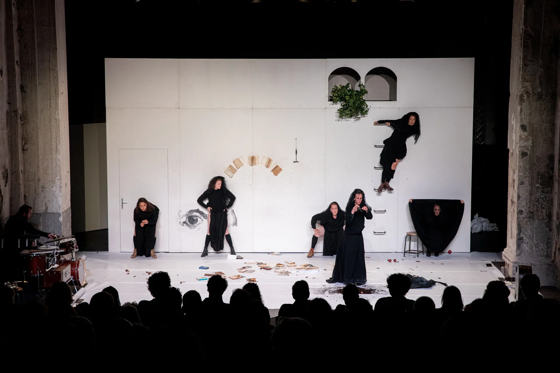 Festival di Spoleto theatrical performance with performers in black on minimalist stage