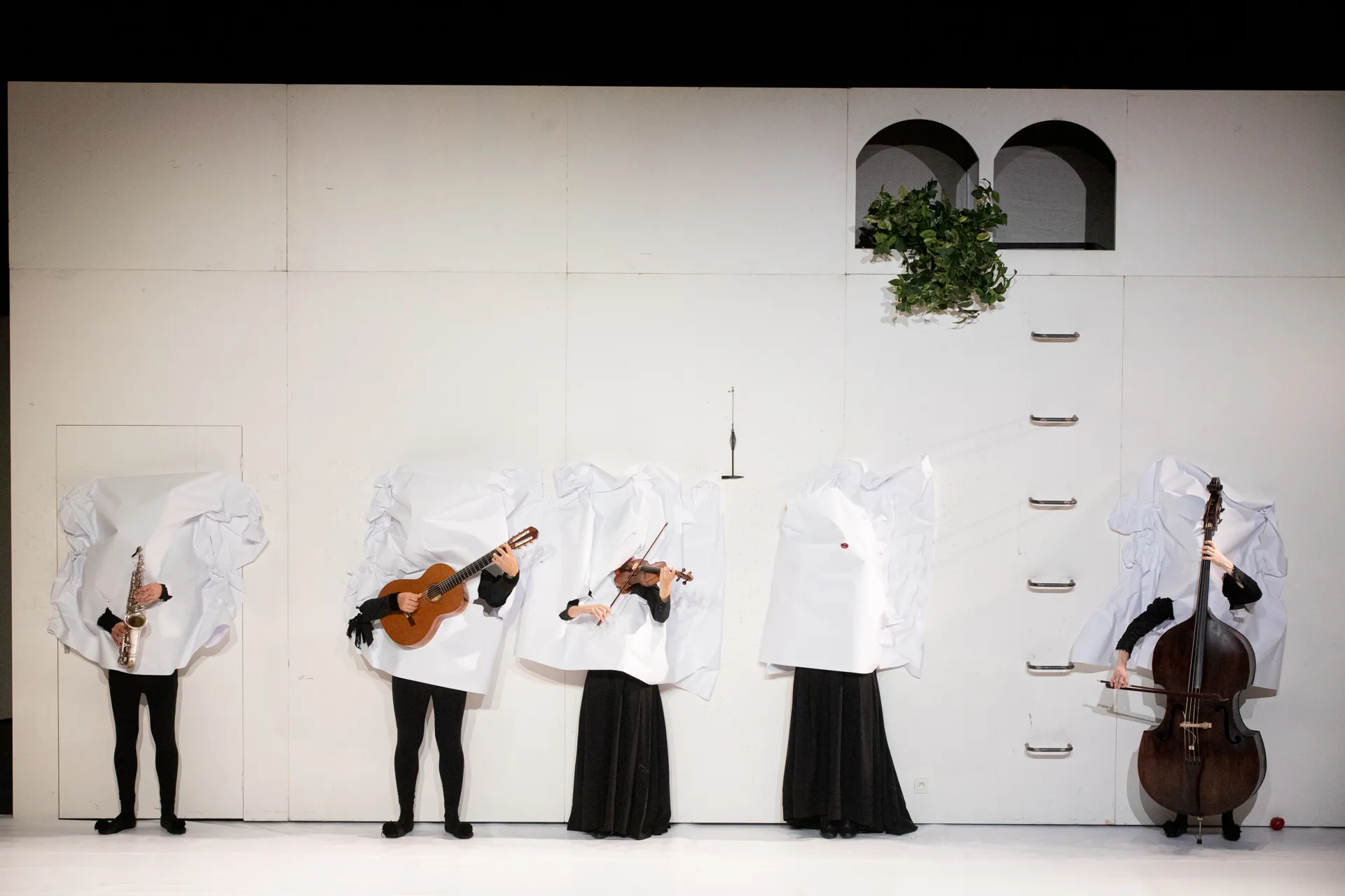 Musicians in white costumes performing at Festival di Spoleto concert stage