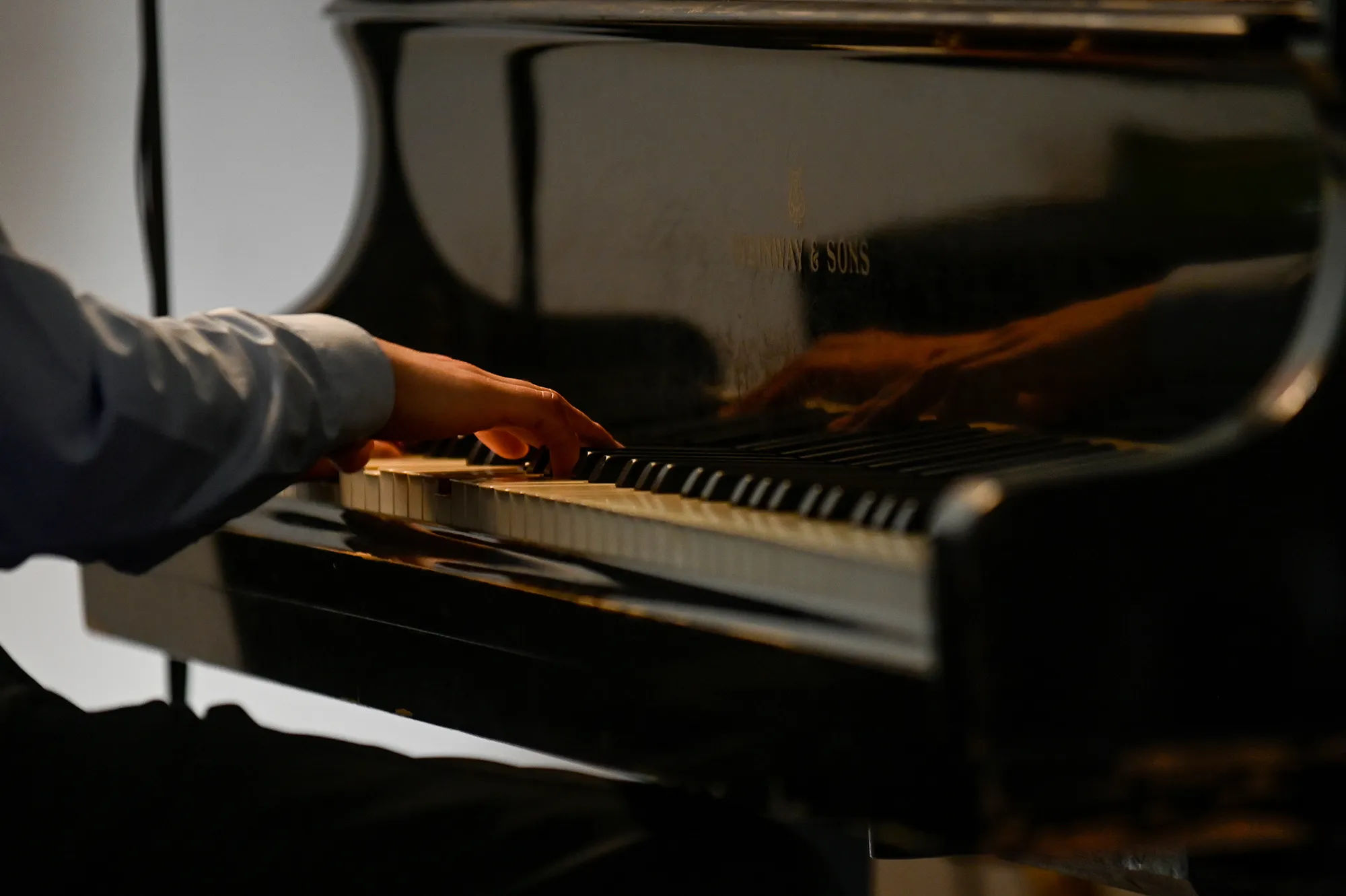 Pianist's hand playing Steinway piano at Festival di Spoleto music event